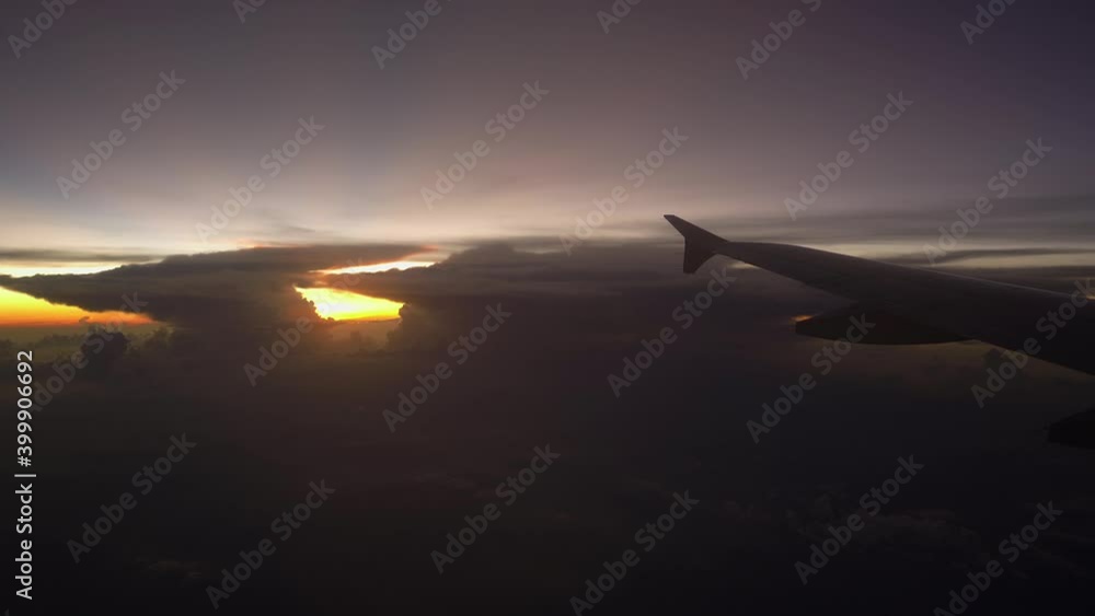 Airplane wing against thunder sky Airplane wing against thunder sky