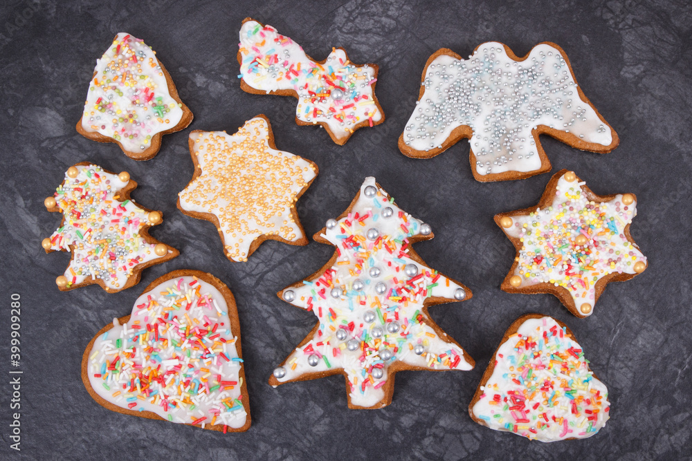 Fresh baked gingerbread in shape of christmas tree, heart and star with decorations for Christmas time Fresh baked gingerbread in shape of christmas tree, heart and star with decorations for Christmas time