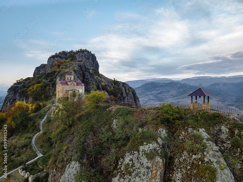 Shoanin christian temple. X century. Karachay-Cherkessia, Dombay, Russia. Mountain, outdoor. Drone shooting