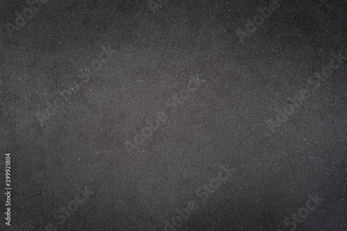 Abstract dark background,Rough surface of black spray paint on Rusty iron plate