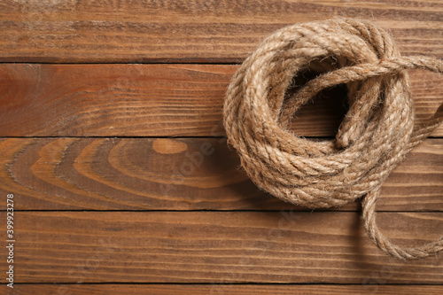 Rolled rope on wooden background