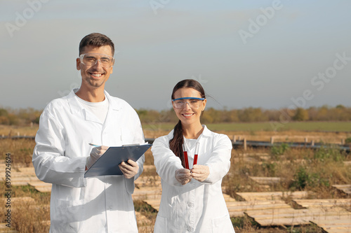 Scientists studying snails at the farm © Pixel-Shot