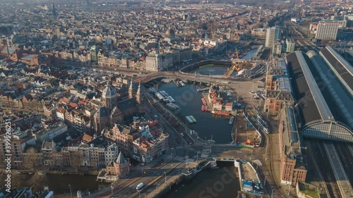 Amsterdam Central Aerial view timelapse hyperlapse, the city center in Amsterdam and the Ij river, The Netherlands ferries and public transport fly over drone shot. photo