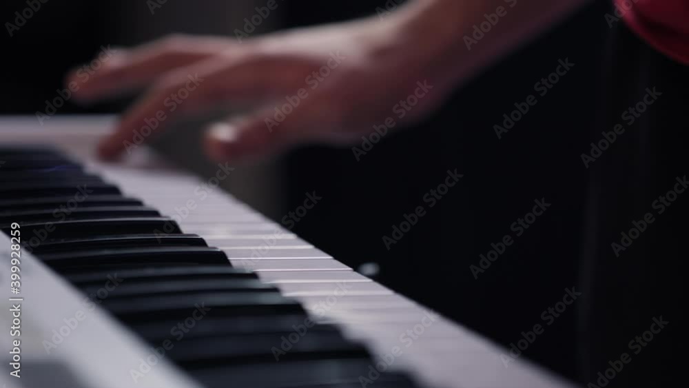 Hands of a male musician playing a synthesizer. Electronic music. Recording Studio. Hands of a male musician playing a synthesizer. Electronic music. Recording Studio.