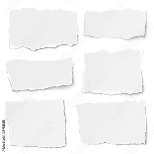 Set of paper different shapes tears lying on white