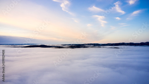 Arial  Photo shot with a drone. Fog in the valley below.  Norway  Oslo  Holmenkollen.