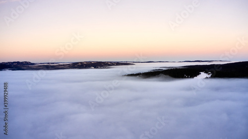 Arial  Photo shot with a drone. Fog in the valley below.  Norway  Oslo  Holmenkollen.