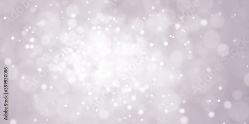 Abstract blue blurred bokeh light on dark background. New Year holiday card template. Magic falling snow backdrop.