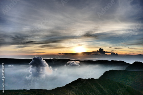 Sunrise view from the summit of Mount Rinjani. In the background is the Island of Sumbawa and Mount Tambora photo