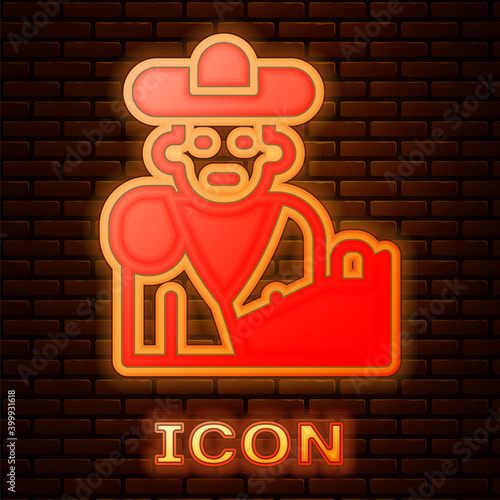 Glowing neon Spain bullfight, matador icon isolated on brick wall background. Traditional Spanish entertainment. Vector.