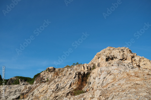 Natural landscape, Rock hill against the blue sky at Khoa Kuha, Songkhla, South of Thailand.