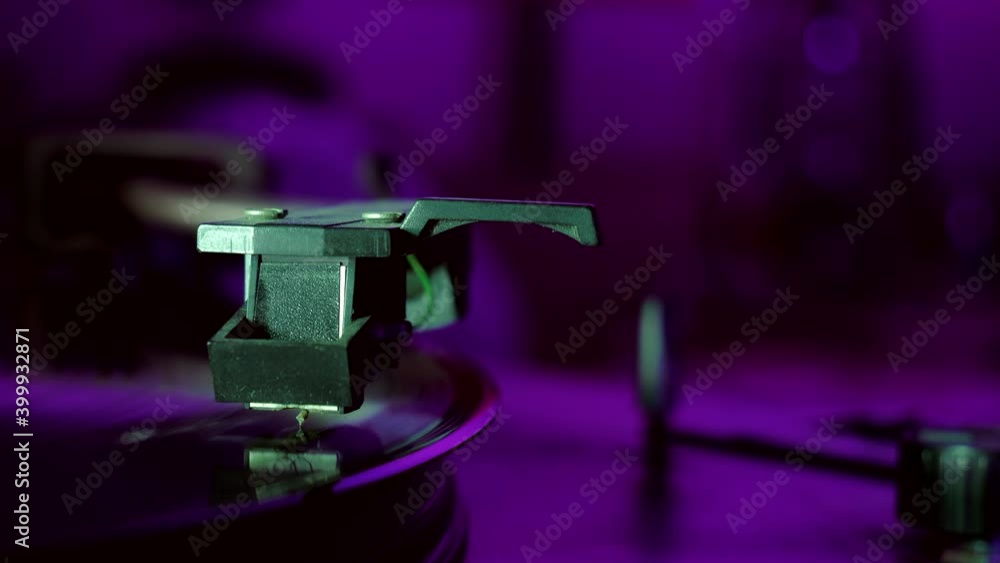 Vinyl record is spinning. Old retro turntable.Turntable stylus on a record Vinyl record is spinning. Old retro turntable.Turntable stylus on a record