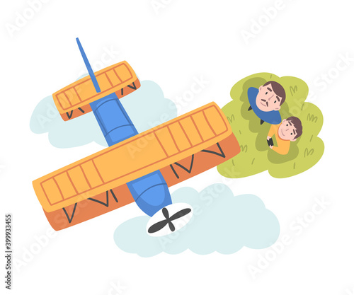 Father and his Son Launching Airplane Model, View from Above of Happy Parent and Child Spending Time Together Outdoors Cartoon Style Vector Illustration