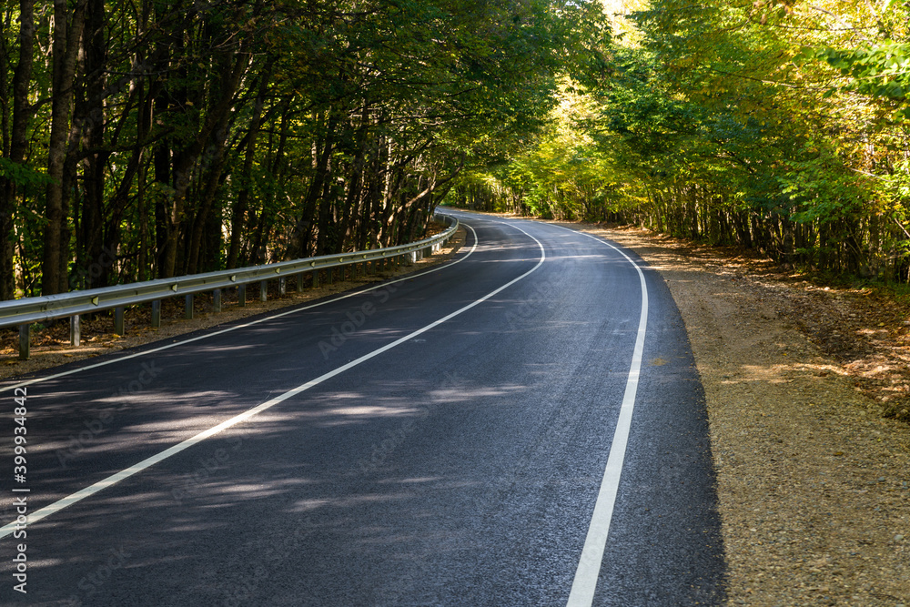 Asphalt road or highway with road markings Asphalt road or highway with road markings