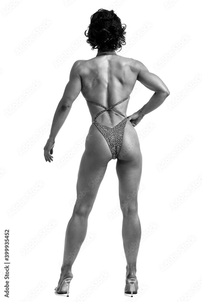 Sexy woman bodybuilder is posing against white background, isolated Sexy woman bodybuilder is posing against white background, isolated