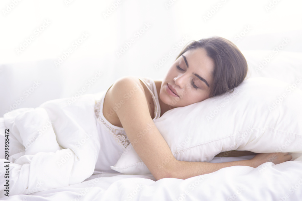 beautiful young woman basking in bed in the morning. Beautiful Model face looks sexy in camera beautiful young woman basking in bed in the morning. Beautiful Model face looks sexy in camera