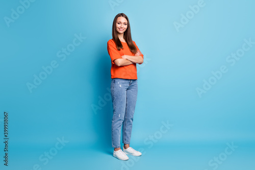 Full length photo of charming confident woman girl wear casual red t-shirt hands arms crossed isolated blue color background