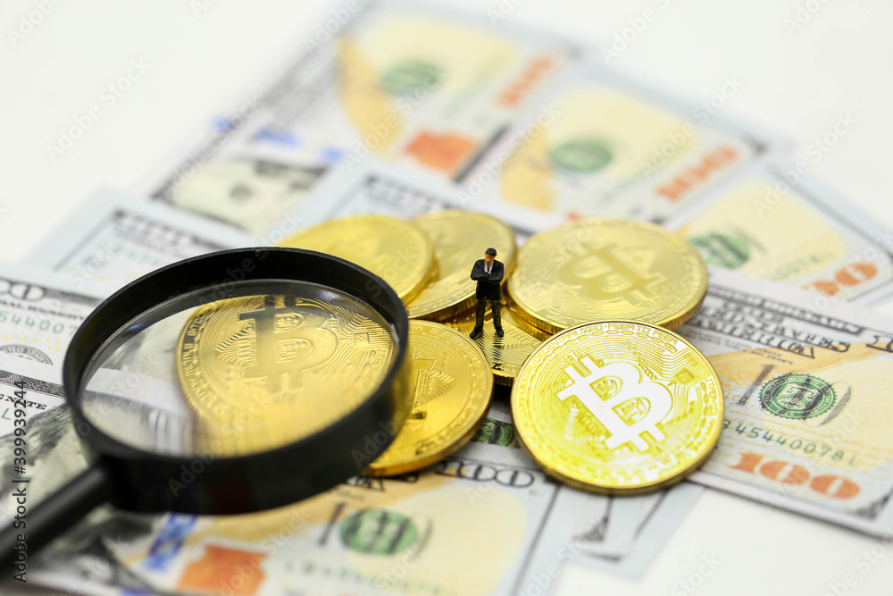Miniature people : Businessman with Cryptocurrency Bitcoin coins virtual money and dollars,will growth up in the future bitcoin investment Miniature people : Businessman with Cryptocurrency Bitcoin coins virtual money and dollars,will growth up in the future bitcoin investment