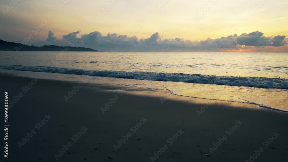 Tropical deserted sandy beach at sunrise. The sound of the surf . Slow motion video. Tropical deserted sandy beach at sunrise. The sound of the surf . Slow motion video.