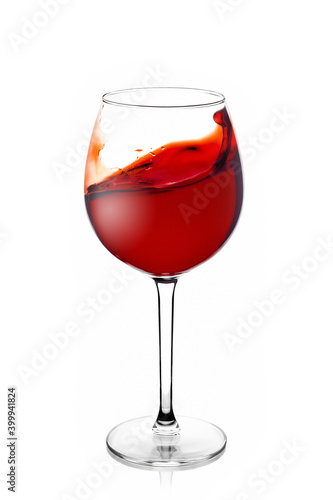 Glass glass with red wine with a splash on a white background