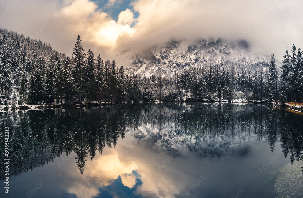 Dramatic landscape of lake in forest near mountains durring winter. Pond on the way to gruner see, Green Lake. Dramatic landscape of lake in forest near mountains durring winter. Pond on the way to gruner see, Green Lake.