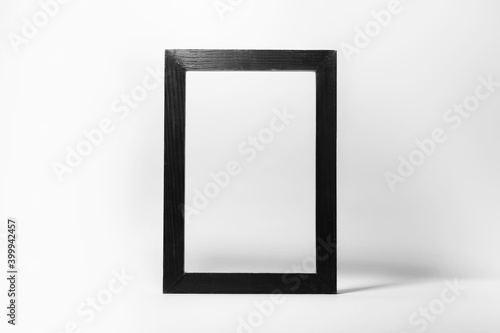 Close-up of black wooden frame isolated on white background with empty space.