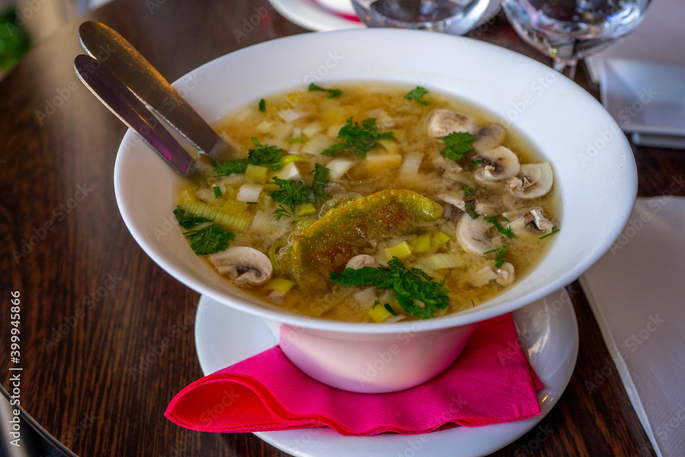 Noodle Bowl With vegetables and dumplings. Close up of a bowl Chinese style on wooden background . Noodle Bowl With vegetables and dumplings. Close up of a bowl Chinese style on wooden background .