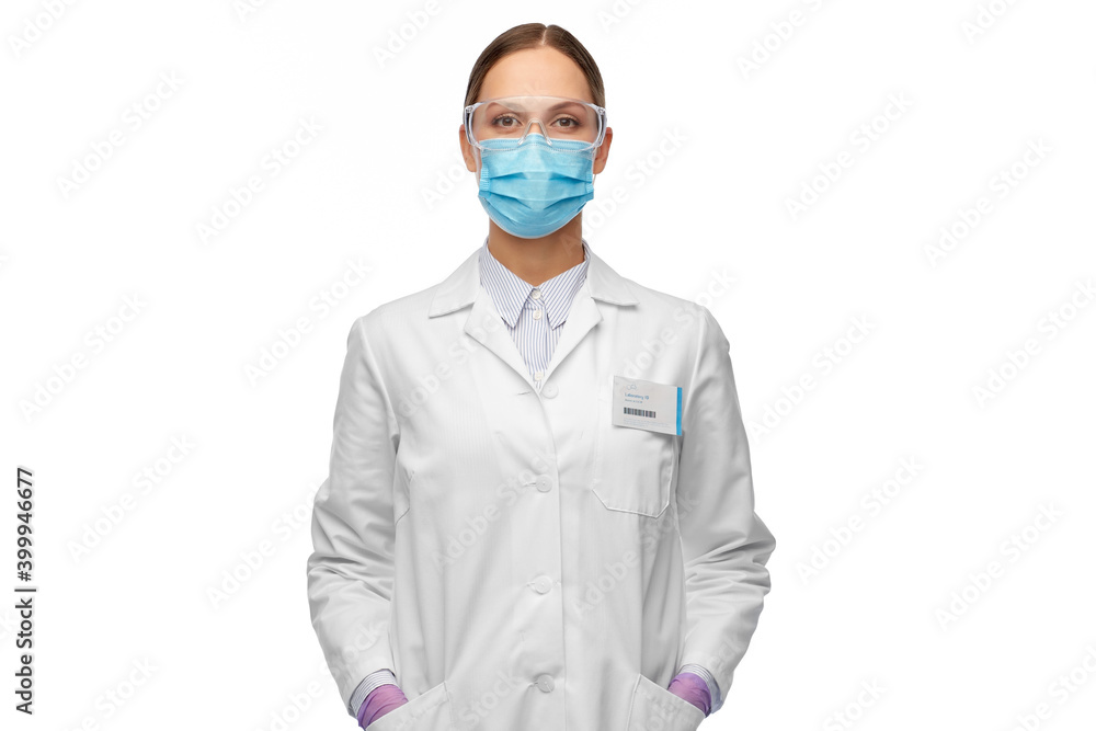 science, health and medicine concept - young female scientist wearing goggles and face protective medical mask for protection from virus science, health and medicine concept - young female scientist wearing goggles and face protective medical mask for protection from virus