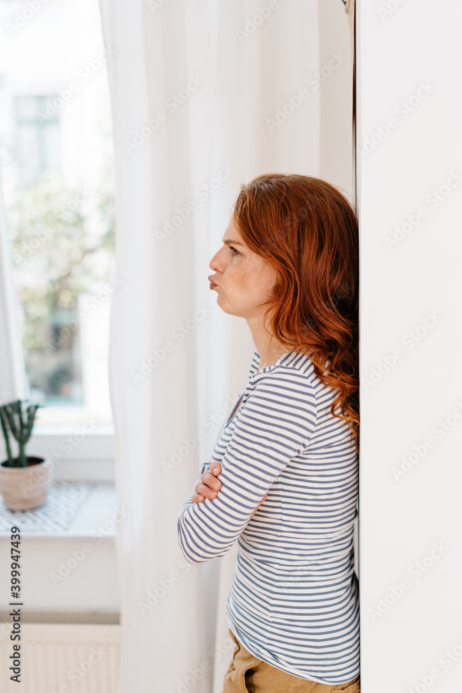 Petulant young woman sulking and pouting her lips Petulant young woman sulking and pouting her lips
