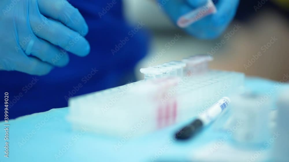 Medical scientist working in lab with probes test tubes glasses. genetic biohacking medicine research. Sport medicine research blood test professional athlete and scientist in modern lab close-up Medical scientist working in lab with probes test tubes glasses. genetic biohacking medicine research. Sport medicine research blood test professional athlete and scientist in modern lab close-up