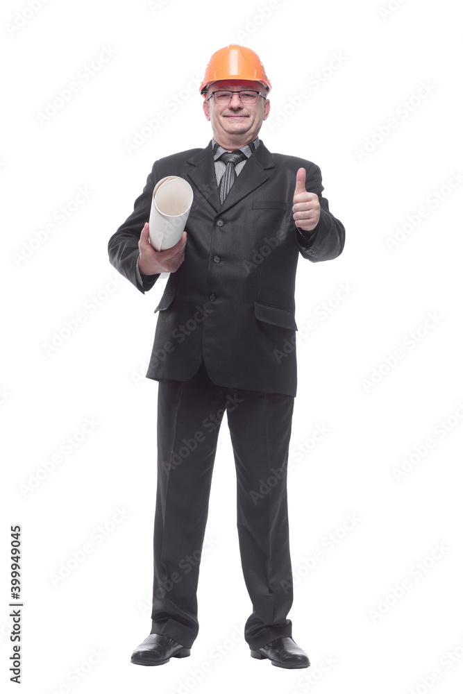 An architect wearing a hard hat and holding plans An architect wearing a hard hat and holding plans