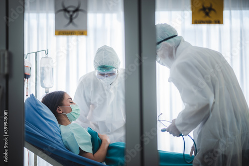 Infected patient in quarantine lying in bed in hospital, coronavirus COVID-19 concept photo