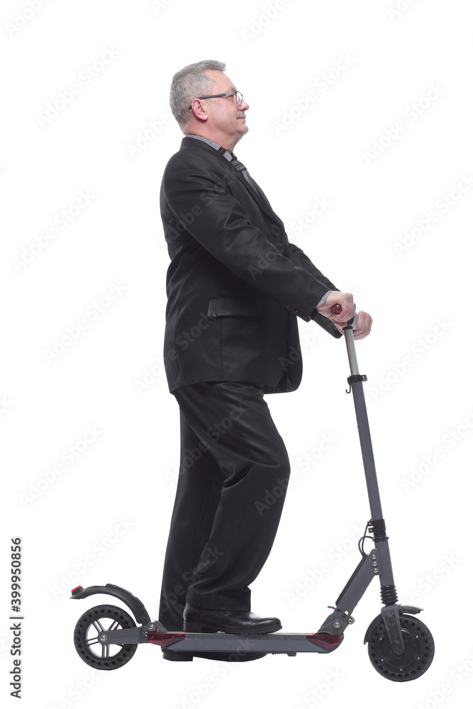Side view of a man wearing suit with scooter Side view of a man wearing suit with scooter
