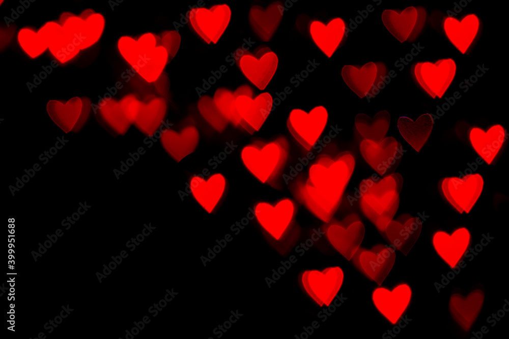 Valentine grunge heart shaped lights background. Red heart-shaped on black background. Red bokeh lights heart soft, heart Background colorful
