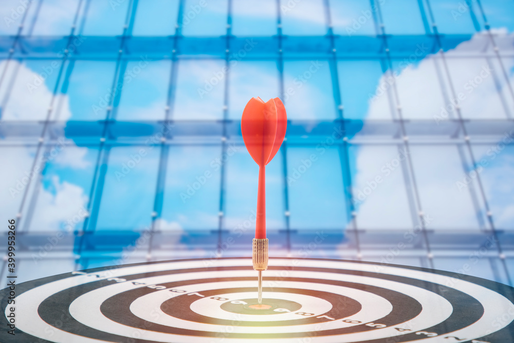 Close up shot of the dart arrow hit on bullseye, red dart arrow hitting in the target center of dartboard Target hit in the center, challenge in business marketing,Target and goal as concept. Close up shot of the dart arrow hit on bullseye, red dart arrow hitting in the target center of dartboard Target hit in the center, challenge in business marketing,Target and goal as concept.