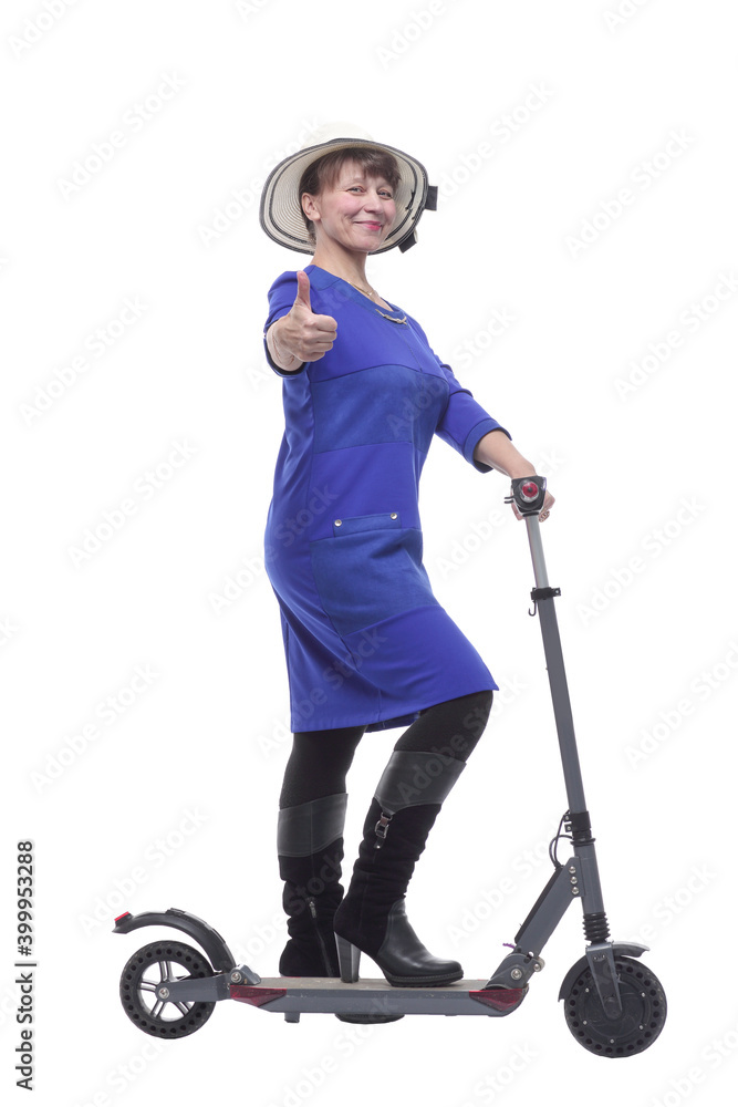 Full length profile shot of an woman with a scooter isolated on white background Full length profile shot of an woman with a scooter isolated on white background