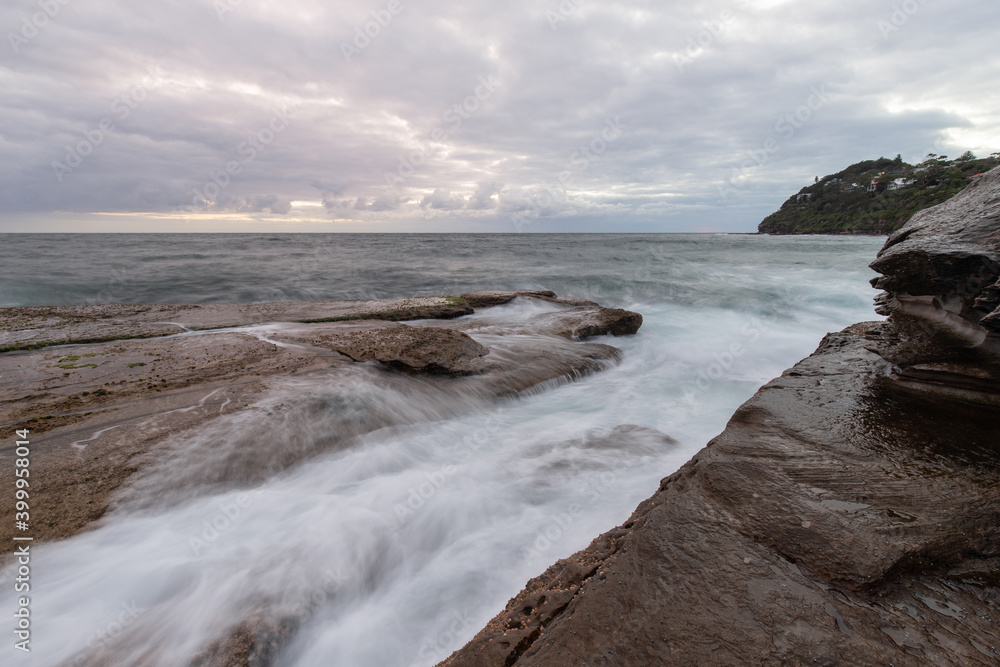 Water flowing in the rocky coastline.