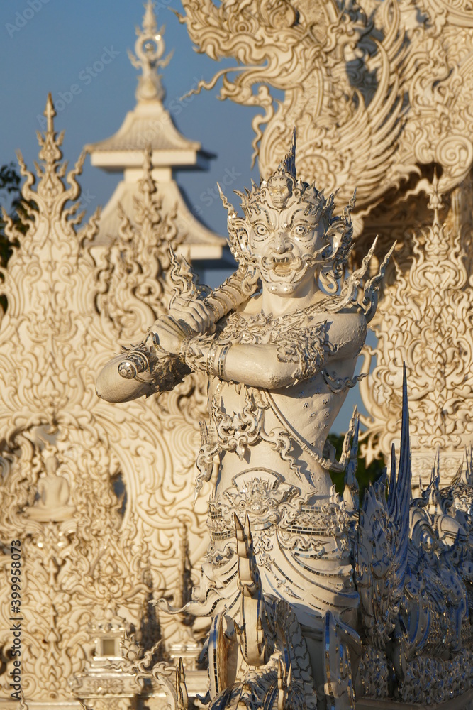 Fototapeta premium Magnificently grand white church and reflection in the water, Rong Khun temple, Chiang Rai province, northern Thailand