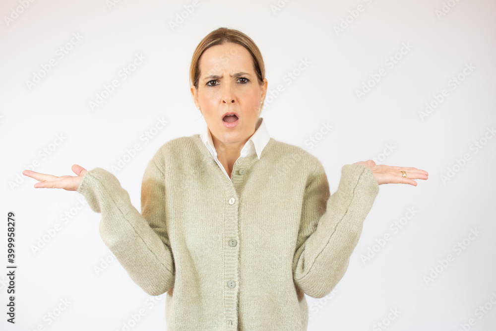Young woman standing over white isolated background clueless and confused expression with arms and hands raised. Doubt concept. Young woman standing over white isolated background clueless and confused expression with arms and hands raised. Doubt concept.