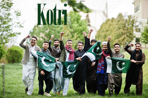 Kotri city. Group of pakistani man wearing traditional clothes with national flags. Biggest cities of Pakistan concept.