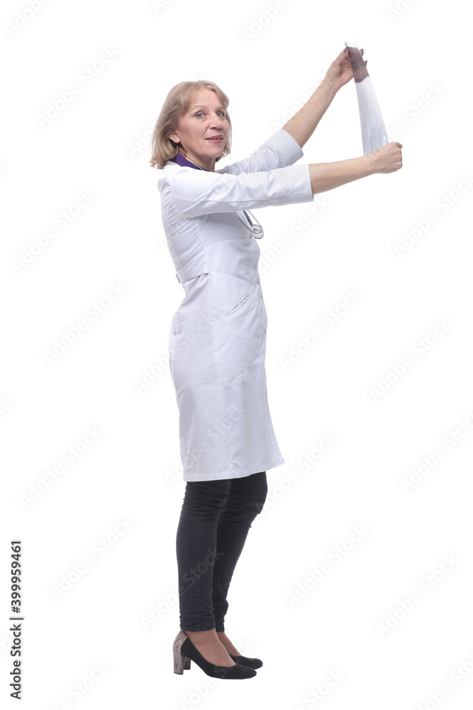 Side view of female doctor looking at x-ray Side view of female doctor looking at x-ray