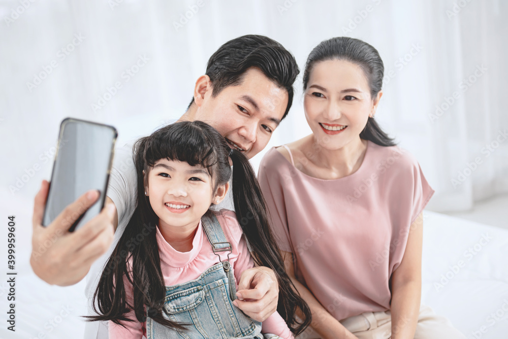 Closeup - Happy asian family taking selfie at home. Closeup - Happy asian family taking selfie at home.