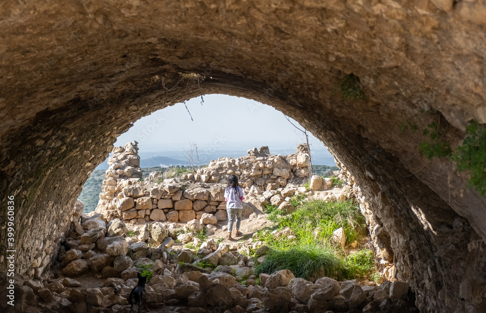 Undefined little girl playing at Crusader's forte at Beit Itab at the Jerusalem Subdistrict