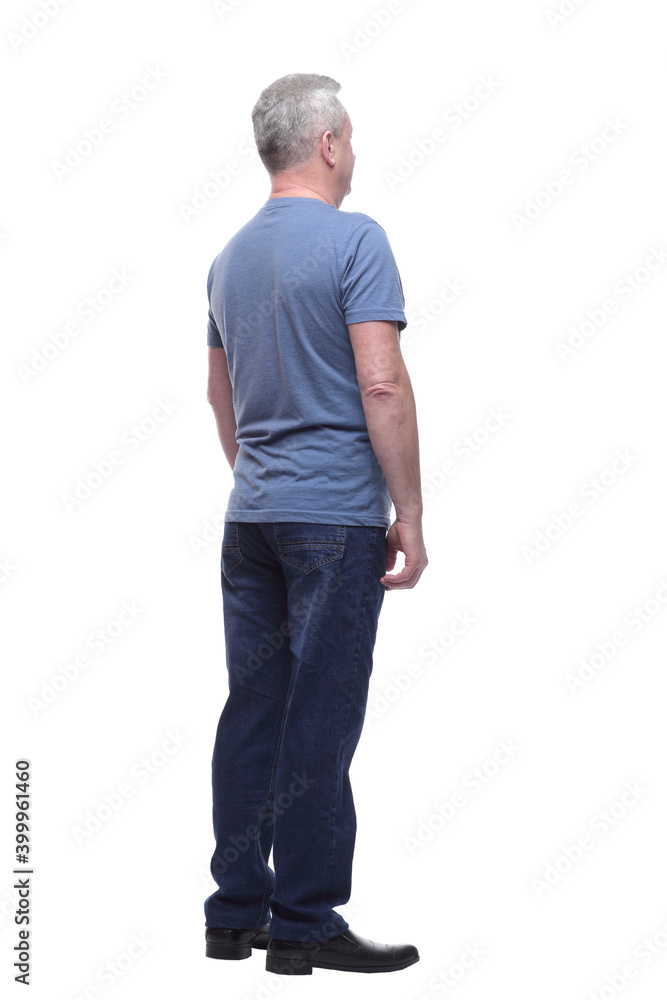 Back view of a man in t-shirt and jeans looking away Back view of a man in t-shirt and jeans looking away