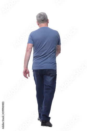 Back view of a man in t-shirt and jeans looking away