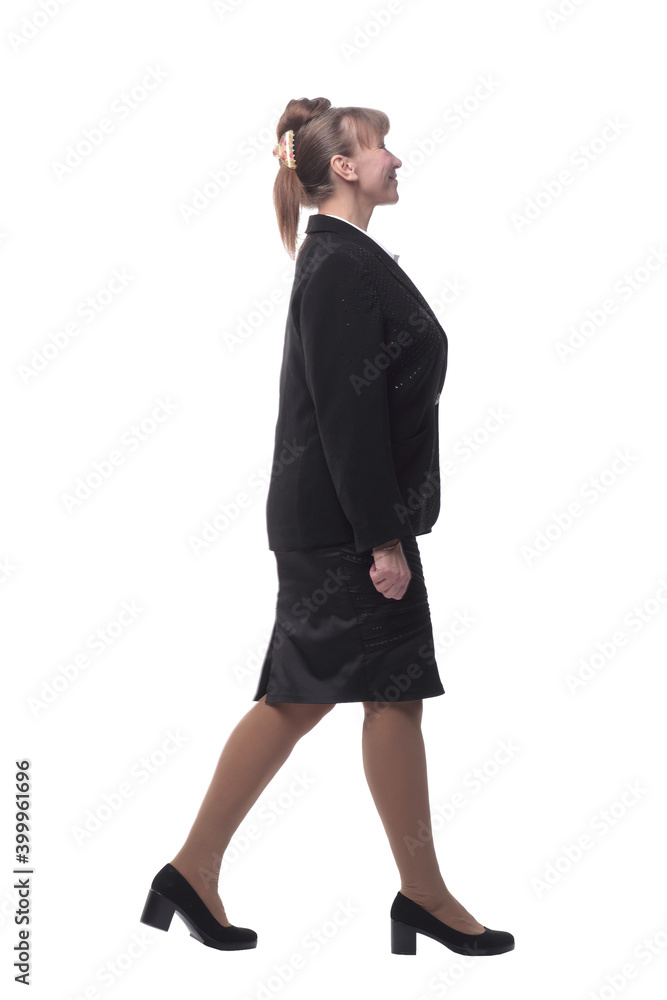 Full lenth business woman walking. She is smiling and looking away from the camera Full lenth business woman walking. She is smiling and looking away from the camera