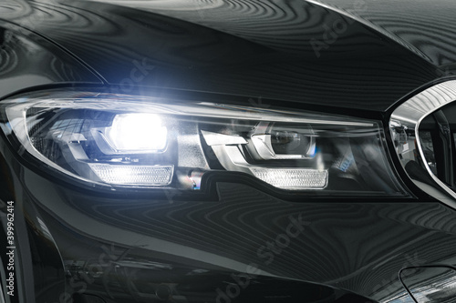 Headlights of a new white luxury car