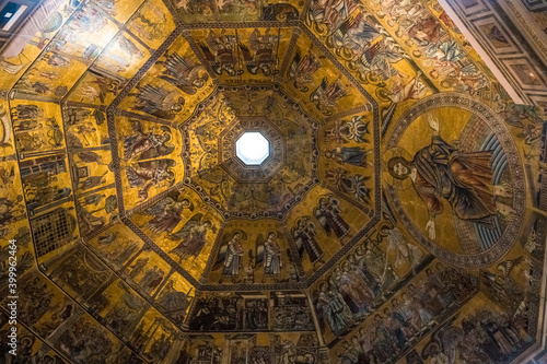 Beautiful close-up view of the magnificent mosaic ceiling inside the famous Florence Baptistery of Saint John. Covered with mosaics on gold backgrounds, it is split into eight segments.
