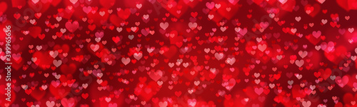 Valentine's Day red abstract background with  glittering hearts.