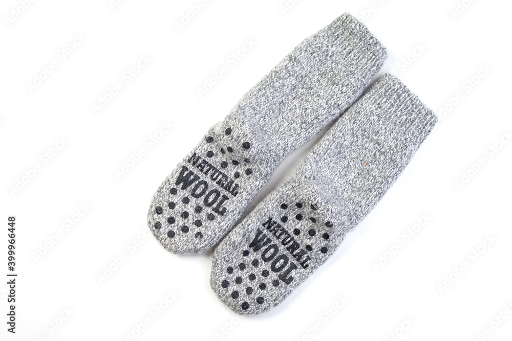 Gray warm knitted wool socks handmade pair for cold winter, isolated Gray warm knitted wool socks handmade pair for cold winter, isolated
